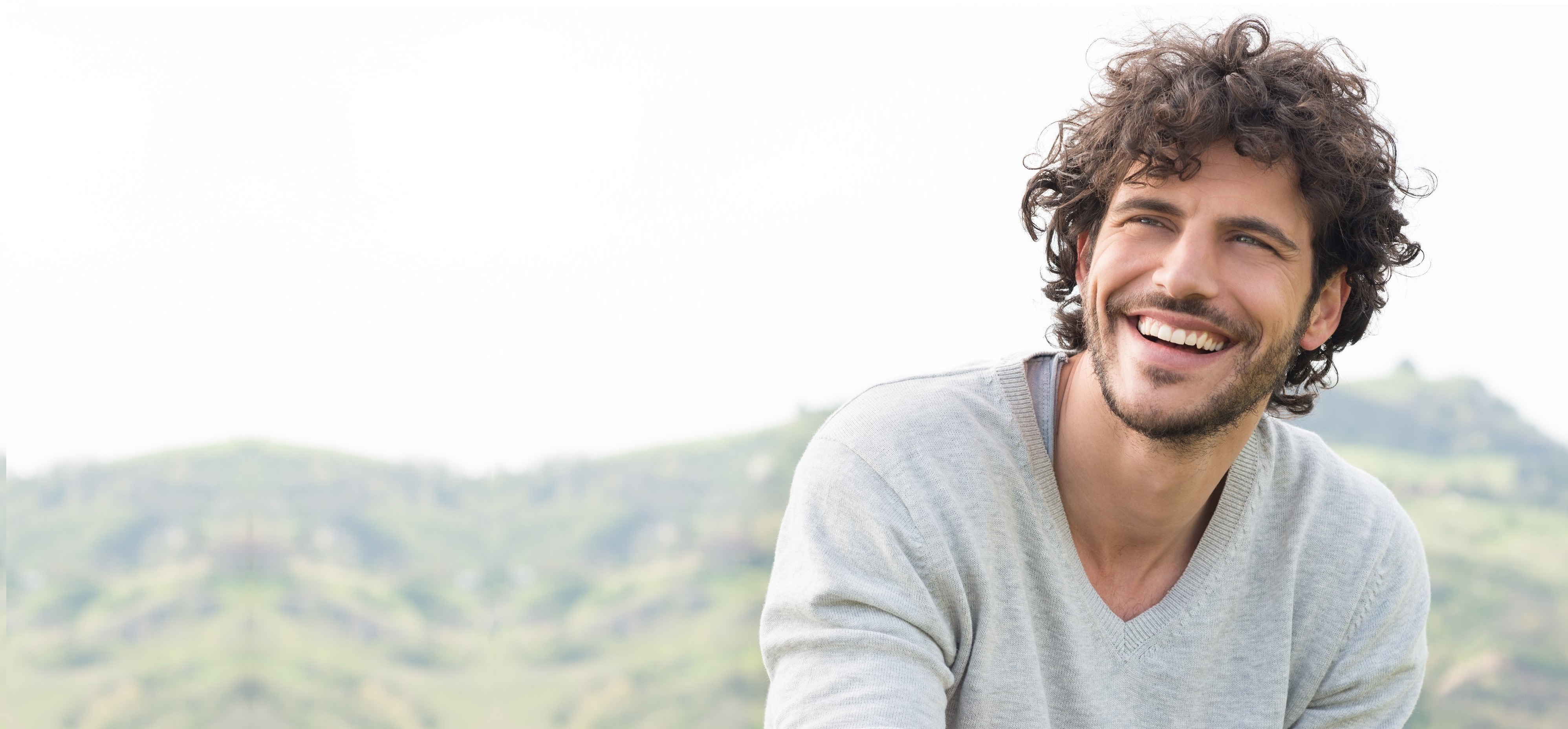 Portrait Of Young Handsome Man Smiling Outdoor